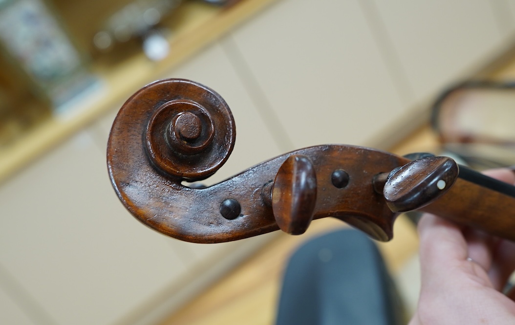 An early 20th century cased Welsh violin, the handwritten label inside the body reads; ‘James Parkinson, Llandudno No.9, 1921’, with a single piece back, inlaid stringing to the edge of the body, length of body 35.5cm, t